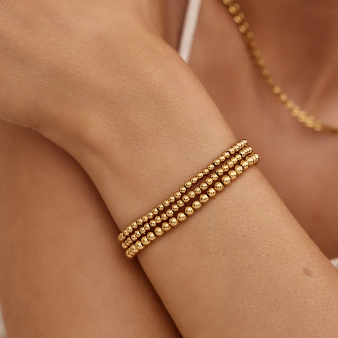 433 Conjunto de Pulseiras com Esferas Douradas